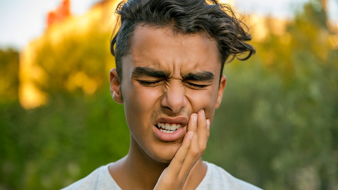 Young man with dental pain